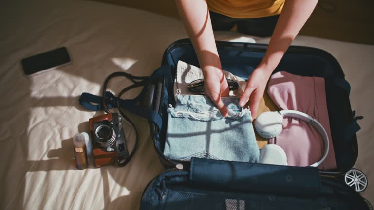 https://media.gettyimages.com/id/1387191878/video/woman-hands-are-packing-suitcase-for-a-journey.jpg?b=1&s=640x640&k=20&c=zV_dNi9lfmfWhzs_CE20f7pSmgzrS0b0afaIERfCUr0=