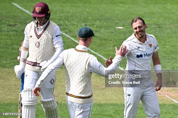 Sam Rainbird of the Tigers celebrates his 8th wicket of the innings during day one of the Sheffield Shield match between Tasmanian Tigers and...