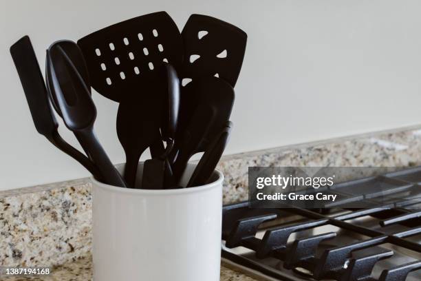 cooking utensils in container on kitchen counter - kökstillbehör bildbanksfoton och bilder