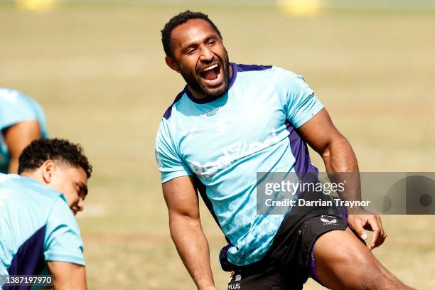 Justin Olam of the Storm laugh during a Melbourne Storm NRL training session at Gosch's Paddock on March 23, 2022 in Melbourne, Australia.