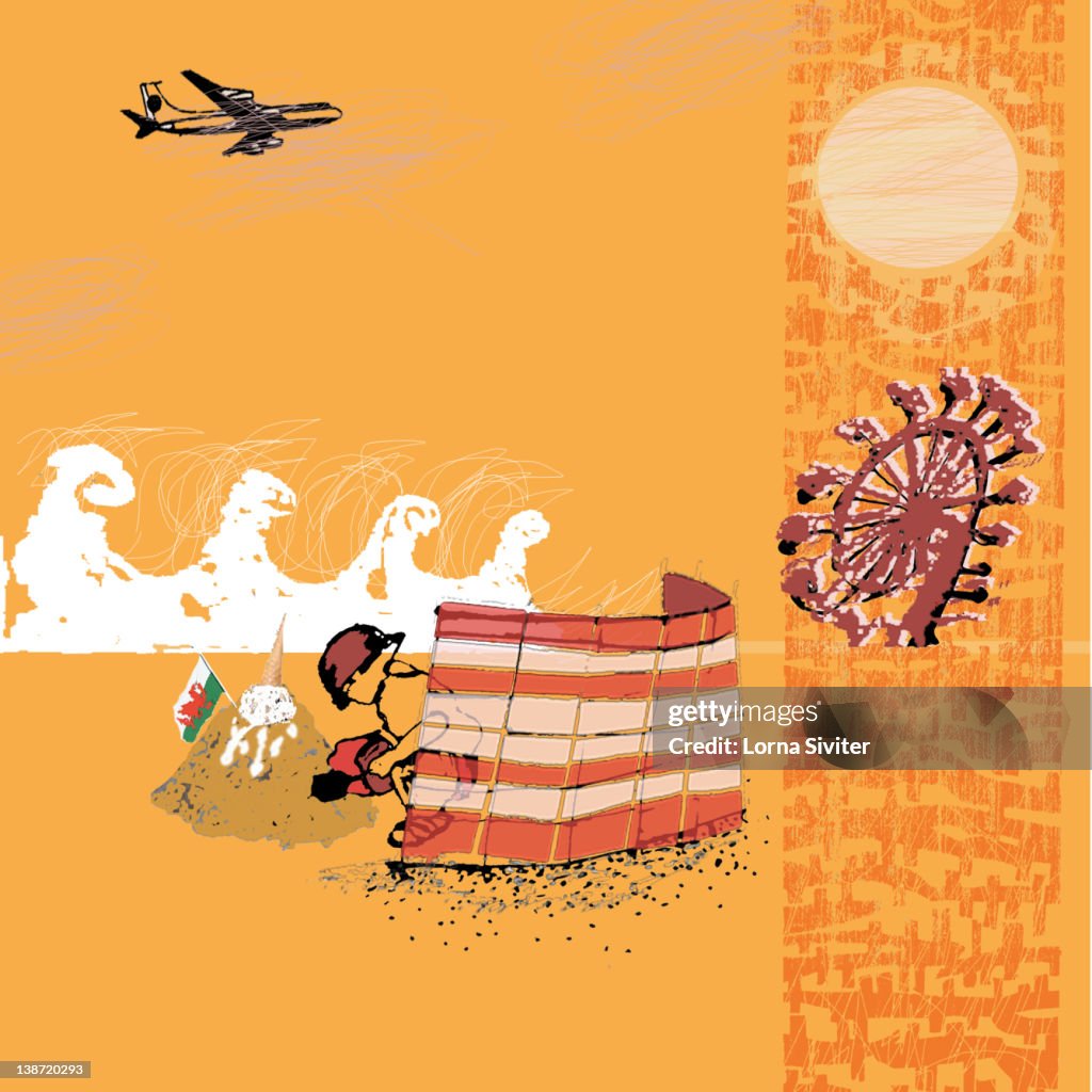 A boy making a sandcastle with a airplane overhead and a ferris wheel in the background