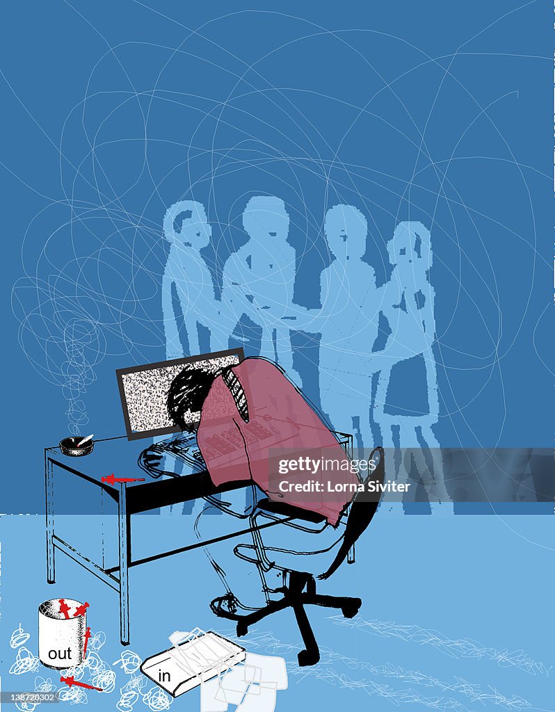 A man hunched over his keyboard