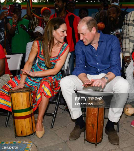 Prince William, Duke of Cambridge and Catherine, Duchess of Cambridge play drums during a visit to Trench Town Culture Yard Museum where Bob Marley...