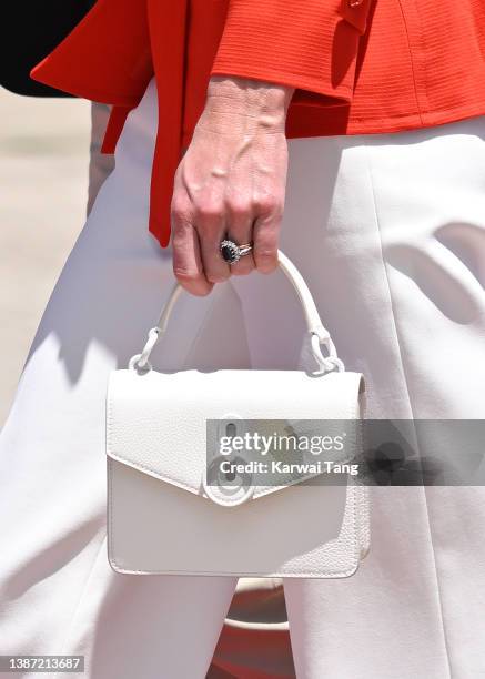 Catherine, Duchess of Cambridge, bag detail, at Philip S. W Goldson International Airport with Prince William, Duke of Cambridge departing Belize for...