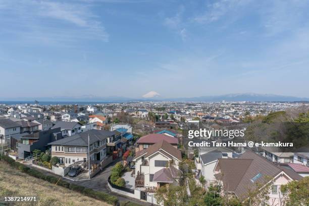 snowcapped mt. fuji and the residential district by the sea in kanagawa of japan - 住宅地 ストックフォトと画像