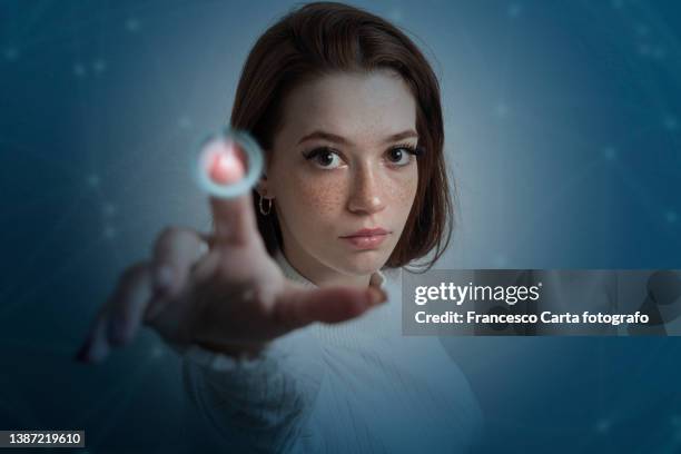 woman  touching power button - finger touchscreen stock-fotos und bilder