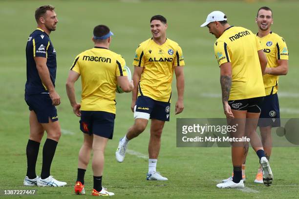 Mitchell Moses talks to Reagan Campbell-Gillard, Bryce Cartwright and Clint Gutherson of the Eels during a Parramatta Eels NRL training session at...