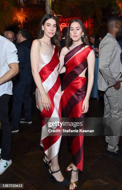 Danielle Haim and Alana Haim attend Vanity Fair and BACARDÍ Rum Celebrate Vanities: A Night for Young Hollywood, in Los Angeles on March 22, 2022 in...