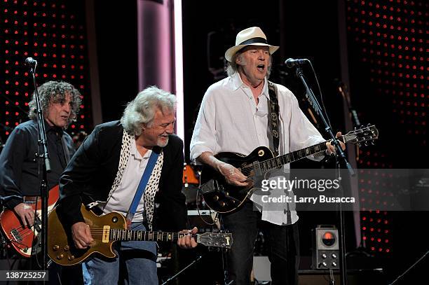 Musicians Billy Talbot, Frank Sampedro, and Neil Young of the band Crazy Horse perform onstage at the 2012 MusiCares Person of the Year Tribute to...