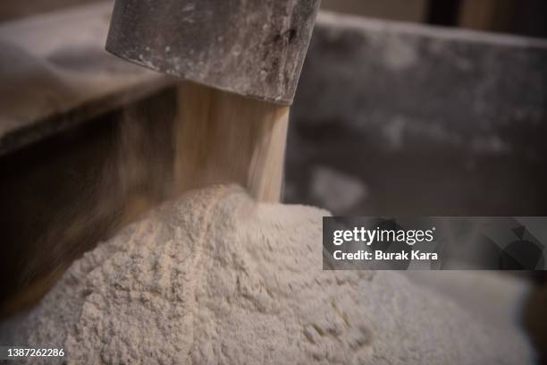 Wheat flour pours into a mixing bowl at a bakery on March 23, 2022 in Istanbul, Turkey. In 2021 Turkey's wheat imports from Ukraine and Russia...