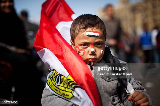 An egyptian boy wears a egyprian national flag at Tharir Square on February 10, 2012 in Cairo, Egypt. Egyptian people await the upcoming first...