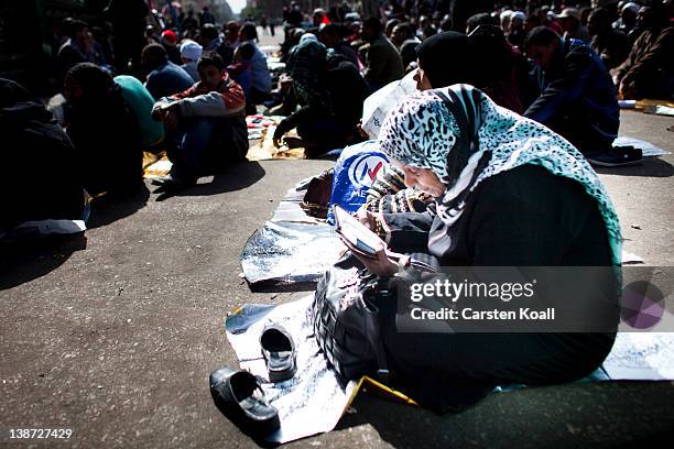 Woman attends friday prayers at Tharir Square on February 10, 2012 in Cairo, Egypt. Egyptian people await the upcoming first anniversary of the...