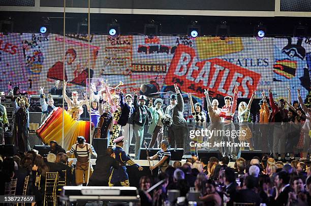 The cast of the Beatles 'LOVE' by Cirque du Soleil perform onstage during the 22nd Annual MusiCares Benefit Gala honoring Sir Paul McCartney held at...