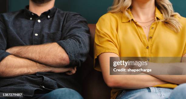 shot of a couple having a disagreement at home - relationship conflict stock pictures, royalty-free photos & images