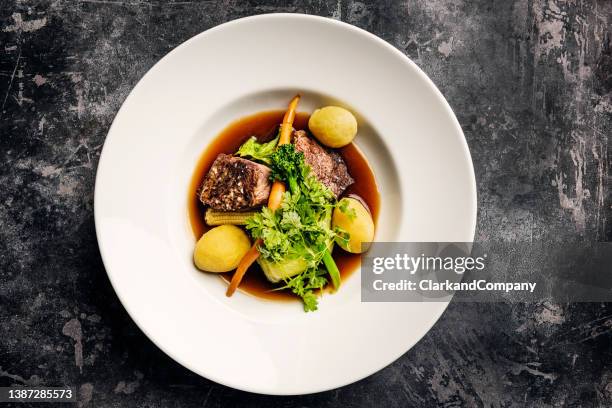 veal medallions with seasonal vegetables. - entrecôte stockfoto's en -beelden