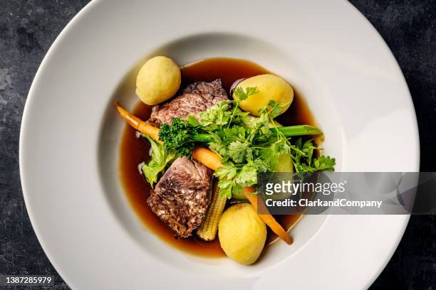 veal medallions with seasonal vegetables. - gourmet steak stock pictures, royalty-free photos & images