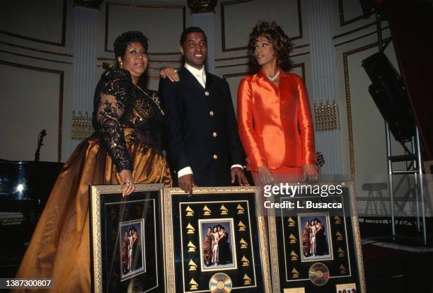 Singer Aretha Franklin, Producer Babyface Edmonds and singer Whitney Houston receives plaque commemorating sales of "Waiting To Exhale" soundtrack...