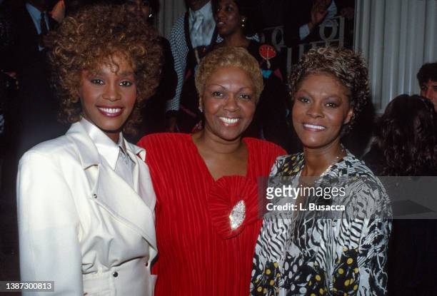 Singers Whitney Houston and her mother, Cissy Houston, with cousin, singer Dionne Warwick during a Grammy Award related party on February 24, 1987.