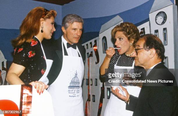 American business executive Georgette Mosbacher , with her husband, Secretary of Commerce Robert Mosbacher , watch as married couple, American...