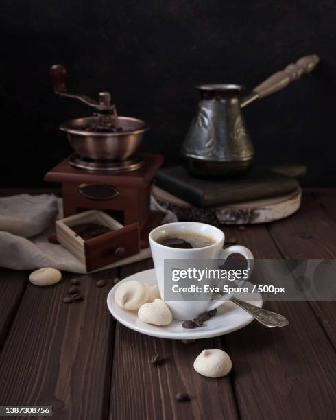 close-up of coffee cup on table,russia - coffee grinder stock-fotos und bilder