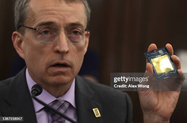 Of Intel Corporation Pat Gelsinger holds up a semiconductor as he testifies during a hearing before Senate Committee on Commerce, Science, and...