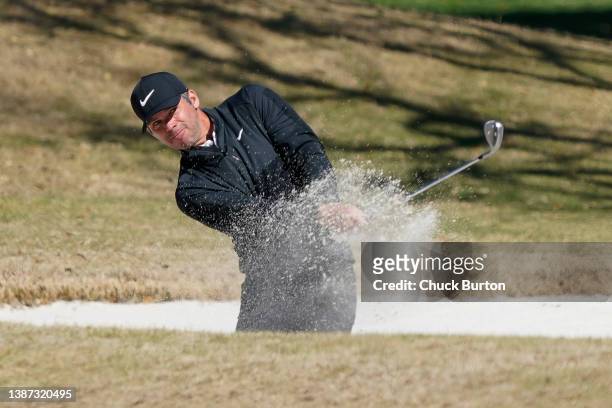 Paul Casey of England plays a shot from a bunker on the first hole during the first day of the World Golf Championships-Dell Technologies Match Play...