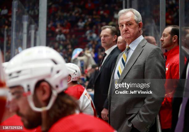 Head coach Darryl Sutter of the Calgary Flames looks on from the bench during their NHL game against the Vancouver Canucks at Rogers Arena March 19,...