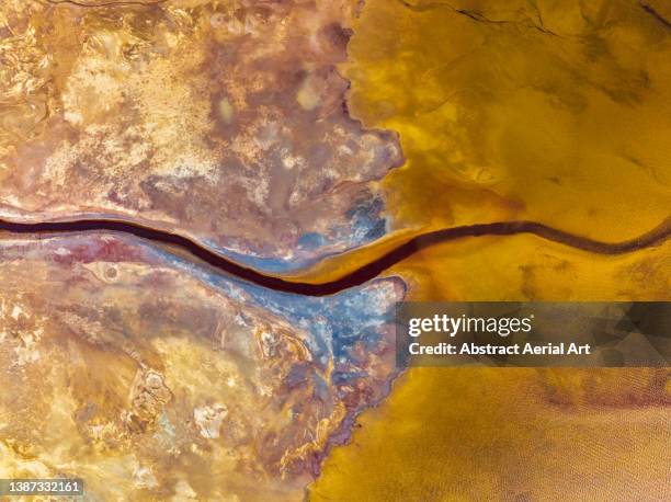 birds-eye perspective showing mine tailings flowing into a lake, bolivia - destruction abstract stock pictures, royalty-free photos & images