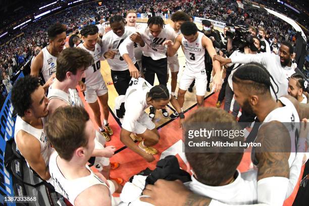 The Providence Friars celebrate winning the second round game of the 2022 NCAA Men's Basketball Tournament against the Richmond Spiders at KeyBank...
