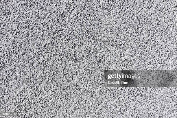 rough plaster on a white wall - textured background - white gravel stock pictures, royalty-free photos & images