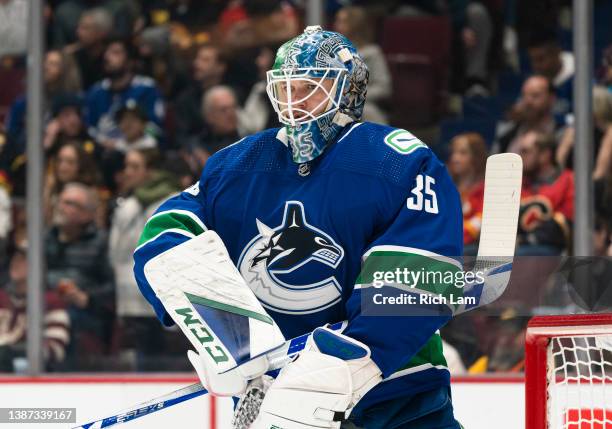 Goalie Thatcher Demko of the Vancouver Canucks readies for a face-off during NHL action against the Calgary Flames on March 2022 at Rogers Arena in...