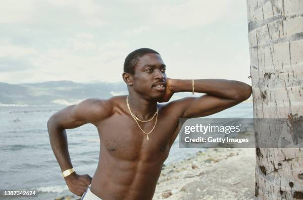 West Indies fast bowler Patrick Patterson poses topless on a beach during the England Cricket tour to the West Indies in 1986.