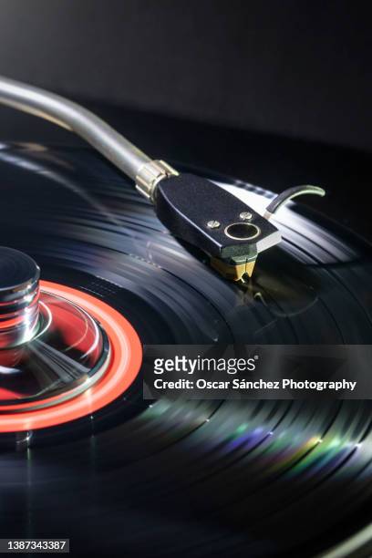 turntable playing  a vinyl - vintage record player no people stock-fotos und bilder