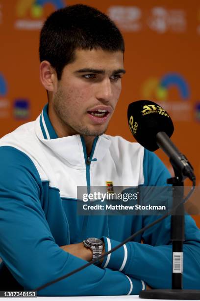 Carlos Alcaraz of Spain fields questions from the media at a press conference during the Miami Open at Hard Rock Stadium on March 23, 2022 in Miami...