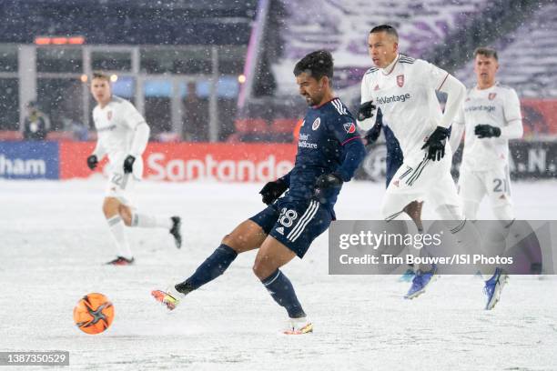 DeLaGarza of New England Revolution passes the ball back to the goalie near the New England Revolution goal during a game between Real Salt Lake and...