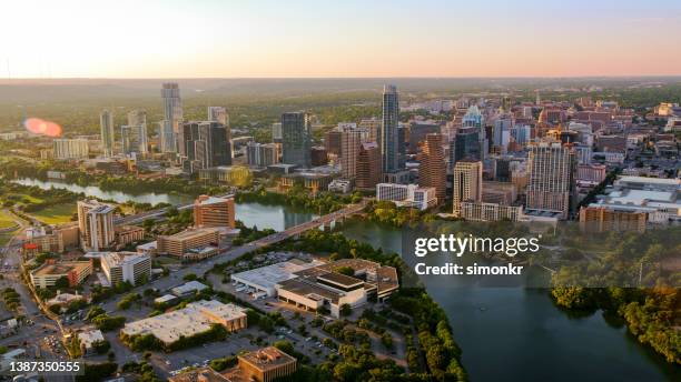 colorado river passing through downtown austin - austin texas aerial stock pictures, royalty-free photos & images