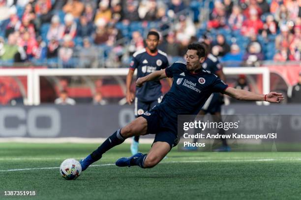 Omar Gonzalez of New England Revolution slides to keep ball away from FC Dallas during a game between FC Dallas and New England Revolution at...