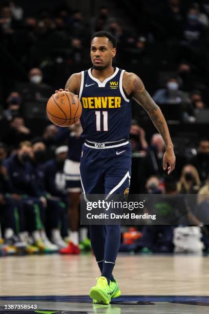 James Ennis III of the Denver Nuggets dribbles the ball against the Minnesota Timberwolves in the first quarter of the game at Target Center on...