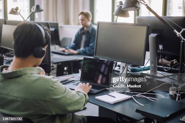 Programmer Working With Code Photos and Premium High Res Pictures ...