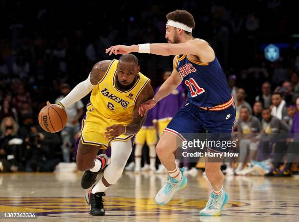 LeBron James of the Los Angeles Lakers drives to the basket on Klay Thompson of the Golden State Warriors during a 124-116 Los Angeles Lakers win at...