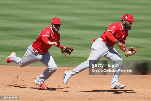 Infielder Luis Rengifo of the Los Angeles Angels fields a groundball out against the San Diego Padres during the fourth inning of the MLB spring...