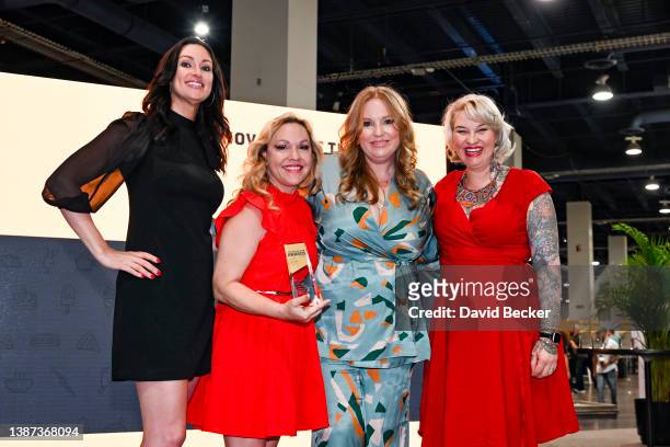 Christie Lawler and Lindsay Johnson pose with Mia Mastroianni and Molly Wellman after winning the awards for Innovator of the Year at the Industry...