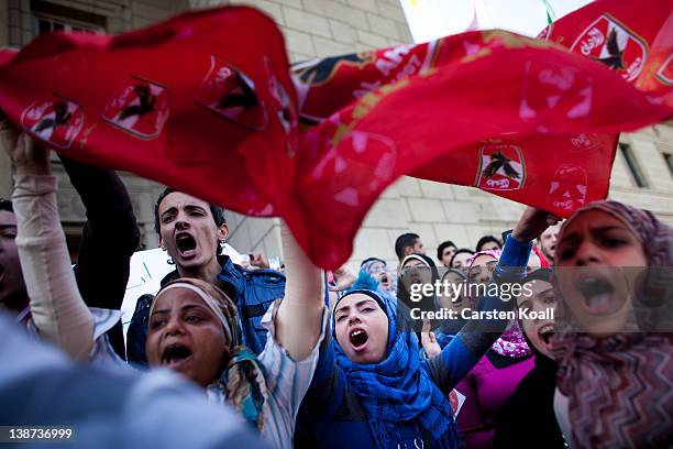 Female students shout slogans in front of the Cairo University during a protest against the military rulers of the country on February 11, 2012 in...