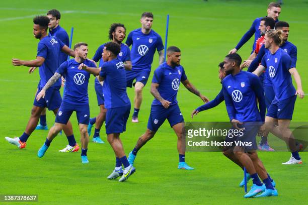 Players of United States warm up during a training session and field scouting ahead of their CONCACAF Qualifier match against Mexico at Azteca...