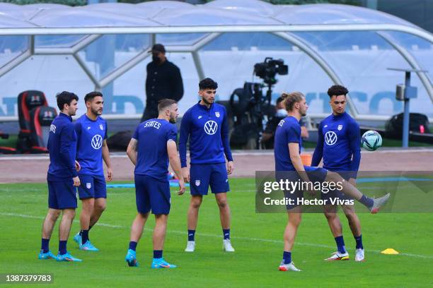 Players of United States warm up during a training session and field scouting ahead of their CONCACAF Qualifier match against Mexico at Azteca...