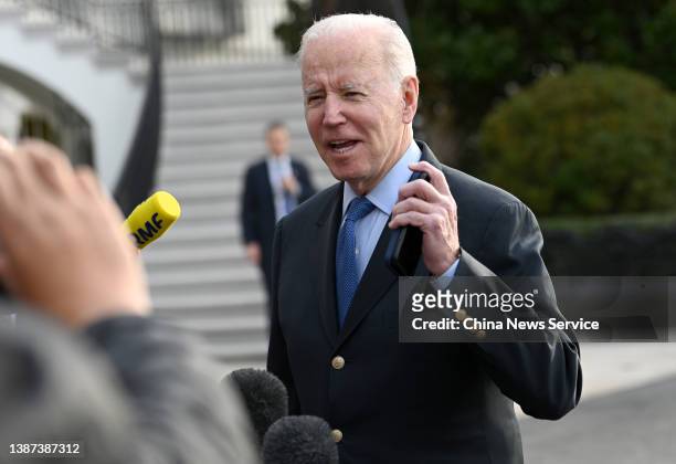 President Joe Biden speaks to the media before boarding Marine One on the South Lawn of the White House on March 23, 2022 in Washington, DC....
