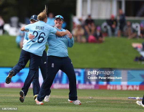 Katherine Brunt and Anya Shrubsole from England celebrate Brunt's bowling out of Sidra Amin from Pakistan during the 2022 ICC Women's Cricket World...