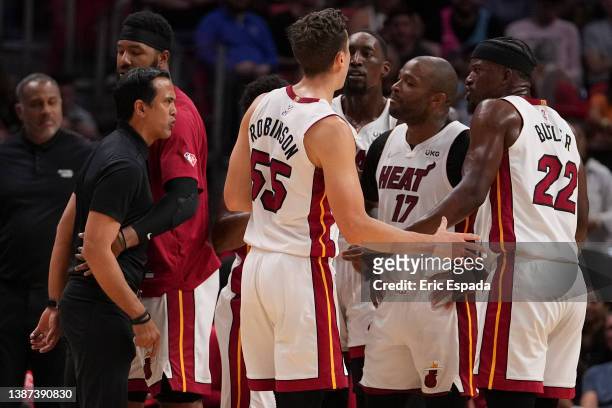 Head coach Erik Spoelstra of the Miami Heat yells at Jimmy Butler during a timeout in the second half against the Golden State Warriors at FTX Arena...