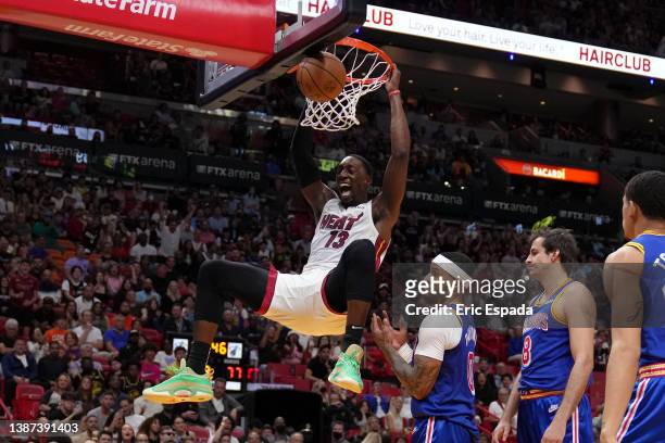 Bam Adebayo of the Miami Heat dunks in the second half against the Golden State Warriors at FTX Arena on March 23, 2022 in Miami, Florida. NOTE TO...