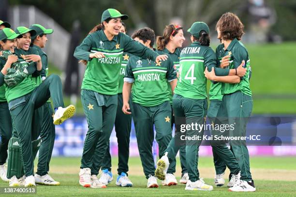 Diana Baig of Pakistan celebrates the wicket of Tammy Beaumont of England during the 2022 ICC Women's Cricket World Cup match between England and...